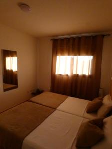 A bed or beds in a room at VV El Picón