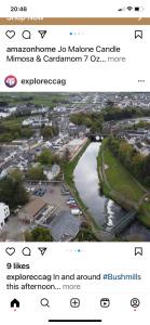 a screenshot of a website with a picture of a river at Bushmills Boutique Apartment in Bushmills
