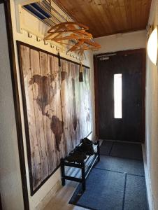 a room with a wall with a map on the wall at Le chemin des étoiles in Evolène