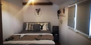 a bedroom with a bed with pillows on it at Bijou Hollandia in Engelberg