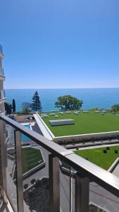 a view of the ocean from the balcony of a building at DNV Apartments 30 Varna in Varna City