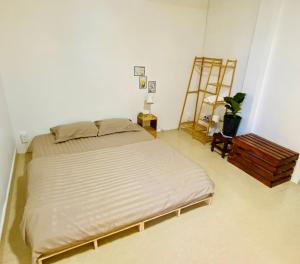 Postel nebo postele na pokoji v ubytování Umee Stayin Đà Lạt