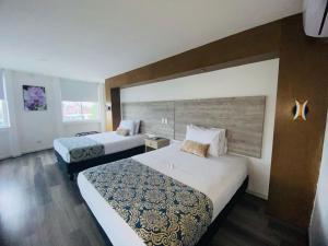 Voodi või voodid majutusasutuse Hotel Metropolis Plaza Cali toas