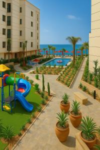 a playground with a water park with a slide at Seaside Bliss Getaway in Port Said +45 photos