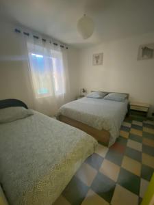 Postel nebo postele na pokoji v ubytování la Porte bleue