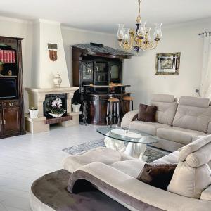 a living room with a couch and a table at Villa Royal Natura - Private Villa in Pombal in Pombal