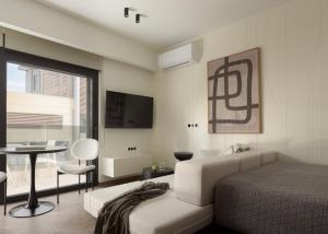 Postel nebo postele na pokoji v ubytování Allegro Suites