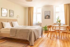 Posteľ alebo postele v izbe v ubytovaní Cocorico Apartments