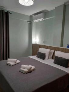 Postel nebo postele na pokoji v ubytování VATA apartaments
