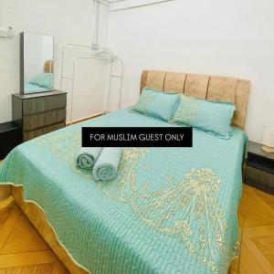 a bedroom with a bed with a sign that reads for musthm guest only at Fadzly Homestay D'Jasin in Jasin