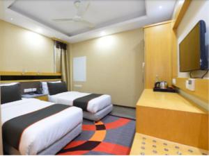 Postel nebo postele na pokoji v ubytování Hotel Bharat Stay A Family Hotel - Delhi Airport