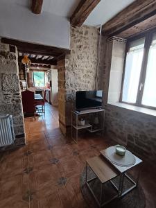 Μια τηλεόραση ή/και κέντρο ψυχαγωγίας στο Maison au bord de l'eau