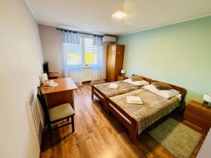 Postel nebo postele na pokoji v ubytování Motel R9 SYLWO