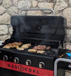 a grill with meat and other food on it at B&B Casal Cominium in San Donato Val di Comino +80 photos