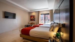 Postel nebo postele na pokoji v ubytování Kech Boutique Hotel & Spa