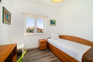 Ένα ή περισσότερα κρεβάτια σε δωμάτιο στο WHome Sea Breeze House with Pool & BBQ in Ericeira +21 φωτογραφίες