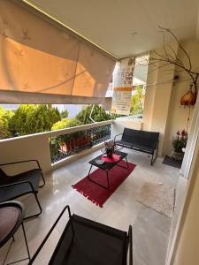 a living room with a couch and a table at C' est la vie in Nafplio