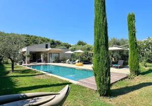 a house with a swimming pool in a yard at Ines By Terrys Homes in Le Cannet