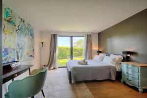a bedroom with a bed with a teddy bear on it at Ines By Terrys Homes in Le Cannet +19 photos