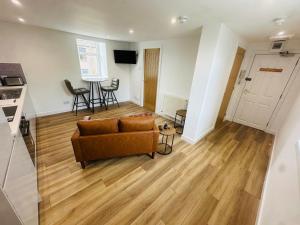 a living room with a couch and a table at Princes Street Executive Apartment 2 in Thurso