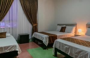 Voodi või voodid majutusasutuse Hotel Cafetto toas