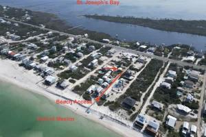 an aerial view of a parking lot next to the water at North Cape- Behing Trading Post - Pet Friendly in Cape San Blas +15 photos