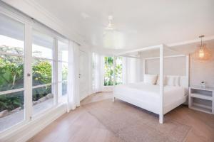 Ένα ή περισσότερα κρεβάτια σε δωμάτιο στο The Retreat Costa Rica - Wellness Resort & Spa