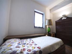 Postel nebo postele na pokoji v ubytování Casa con giardino e vista lago + 10 fotografií