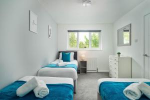 Ένα ή περισσότερα κρεβάτια σε δωμάτιο στο The Acorn Nook - Central Stay