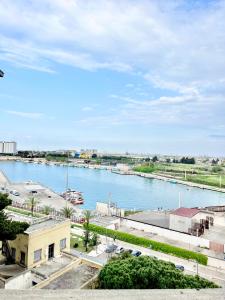 a view of a river with boats in it at MyPuglia, Central Sea-View Suites in Brindisi in Brindisi