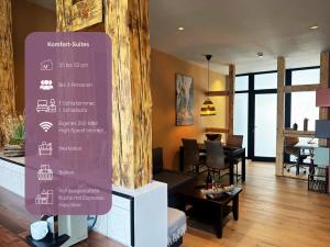 a sign in a room with a living room at Trattoria & Apartments - Casa da Enzo in Goslar