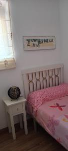 a bedroom with a bed and a table and a window at Casa TEO in Entrena +71 photos