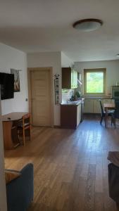 a large living room with a kitchen and a table at CASA VACANZE RELAX in Riva di Solto
