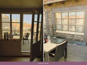 a patio with a glass door and a table on a deck at Trattoria & Apartments - Casa da Enzo in Goslar