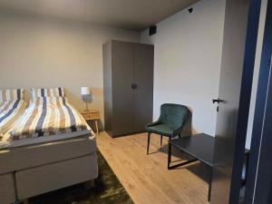 Ένα ή περισσότερα κρεβάτια σε δωμάτιο στο Oceanview Apartment Aalesund