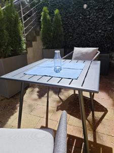 a glass vase sitting on a table on a patio at Apartment Apart Waldershof in Waldershof +52 photos