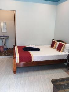 Postel nebo postele na pokoji v ubytování PANMOZHI RESIDENCY
