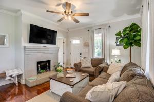 a living room with a couch and a fireplace at Bring Your Boat Retreat Near Lake Guntersville in Guntersville