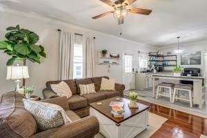 a living room with a couch and a table at Bring Your Boat Retreat Near Lake Guntersville in Guntersville
