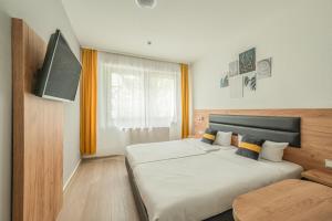 Postel nebo postele na pokoji v ubytování Hotel Gute Hoffnung Pforzheim