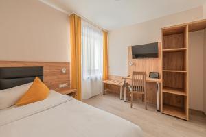 TV a/nebo společenská místnost v ubytování Hotel Gute Hoffnung Pforzheim