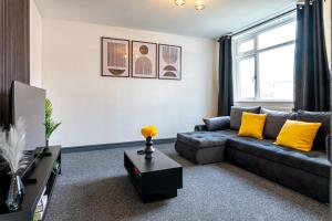 a living room with a couch and a tv at TheHaven in Wolverhampton