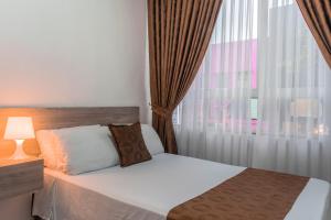 Voodi või voodid majutusasutuse Hotel Cafetto toas