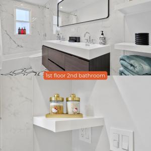 a white bathroom with a sink and a mirror at 6BR3Bth Parking BOS MIT Harvard TD Garden in Somerville