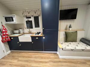 a small kitchen with a sink and a counter at The Bodos Hut in Lintz Green