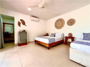 Ένα ή περισσότερα κρεβάτια σε δωμάτιο στο Hotel Carey Beach Baru