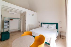 Postel nebo postele na pokoji v ubytování Suites Dimora Garibaldi