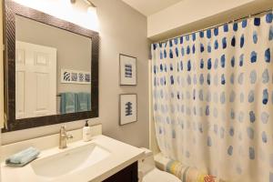 a bathroom with a sink and a mirror at Marlin Cove Pet Friendly Waterfront Retreat in Discovery Bay +42 photos