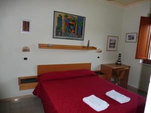 En eller flere senge i et værelse på Residence Santa Maria Suites + 102 billeder