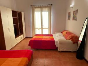 Postel nebo postele na pokoji v ubytování Casa Mare San Vito Lo Capo